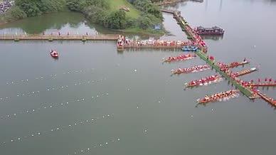 航拍凤凰湖湿地公园龙舟赛端午节素材视频的预览图